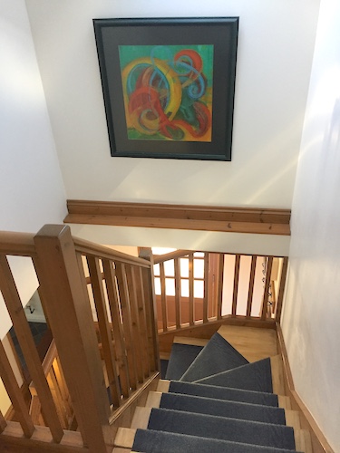 Chy Treza Stairwell with painting by local artist Dave Thomas